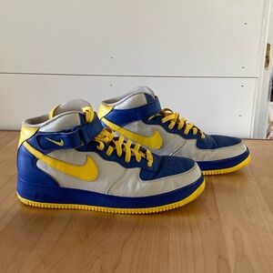 Nike yellow and royal blue Air Force 1. Worn but still great tread on the bottom